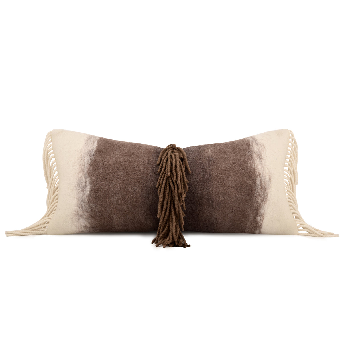 A rectangular throw pillow with a brown and cream cowhide-inspired pattern, featuring cream fringe on the sides and a central brown tassel, shown on a plain white background.