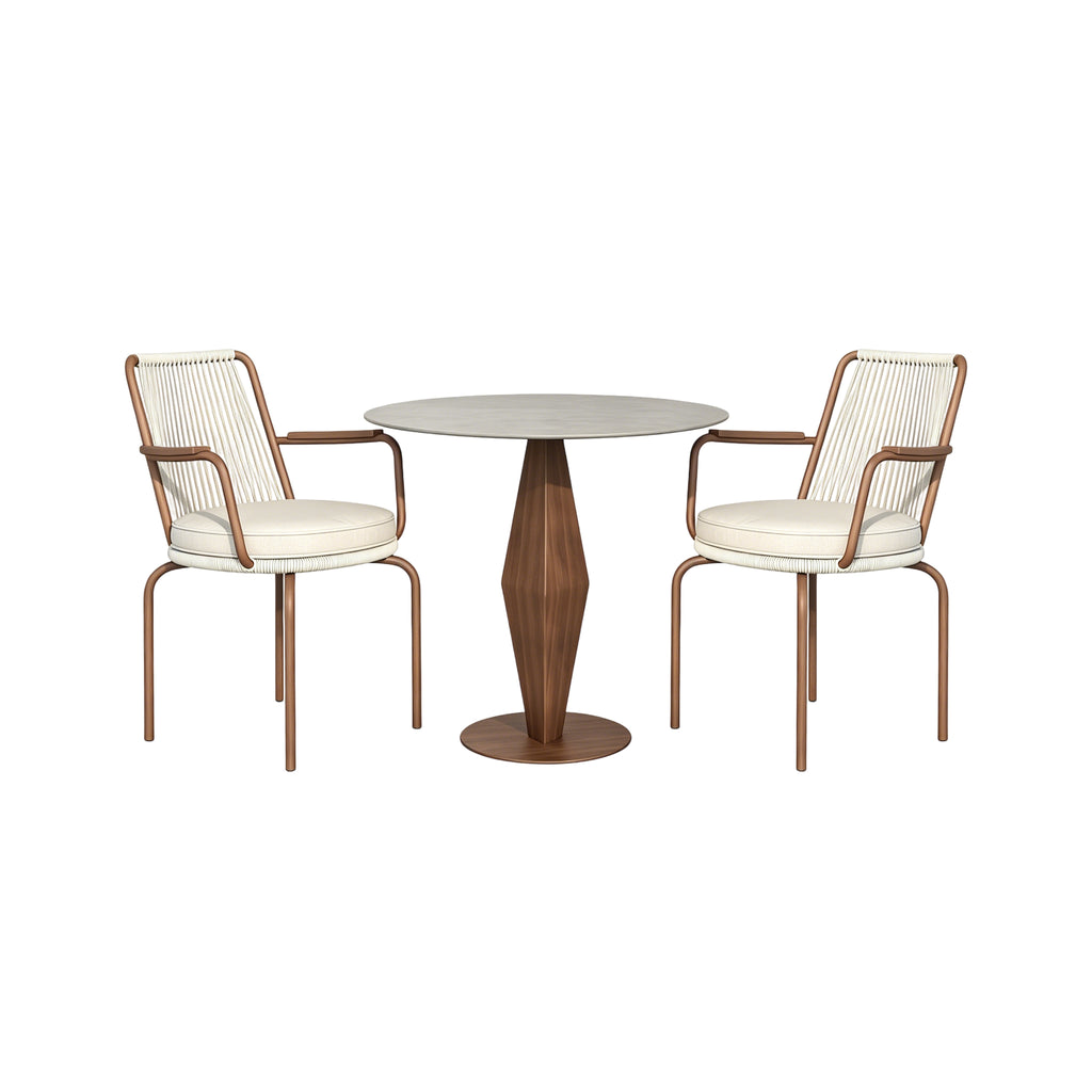 Two chairs with white cushions and wooden frames are placed around a round table with a wooden base 