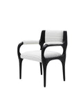 Modern chair with black frame and white cushion,Premium quiet luxury dining armchair with sculptural silhouette, ideal for contemporary dining rooms and boutique hotel spaces.
